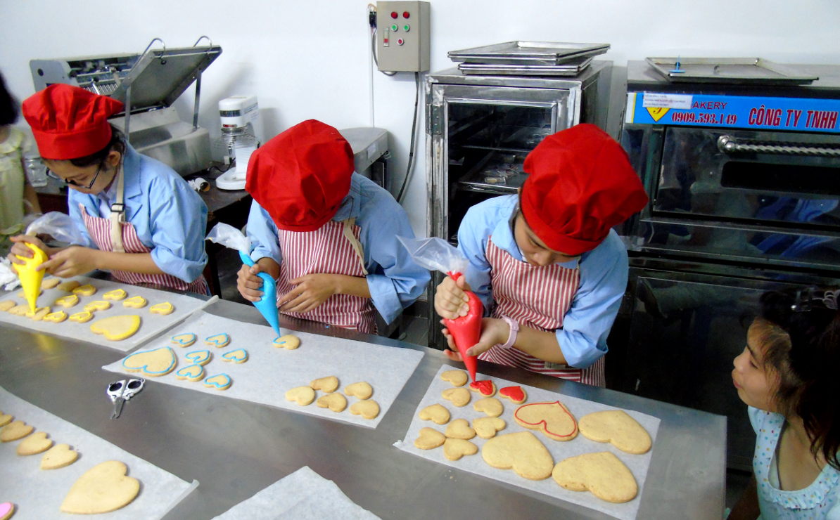 Piping the cookies. Picture by Ian Russell (charityneeds.com).